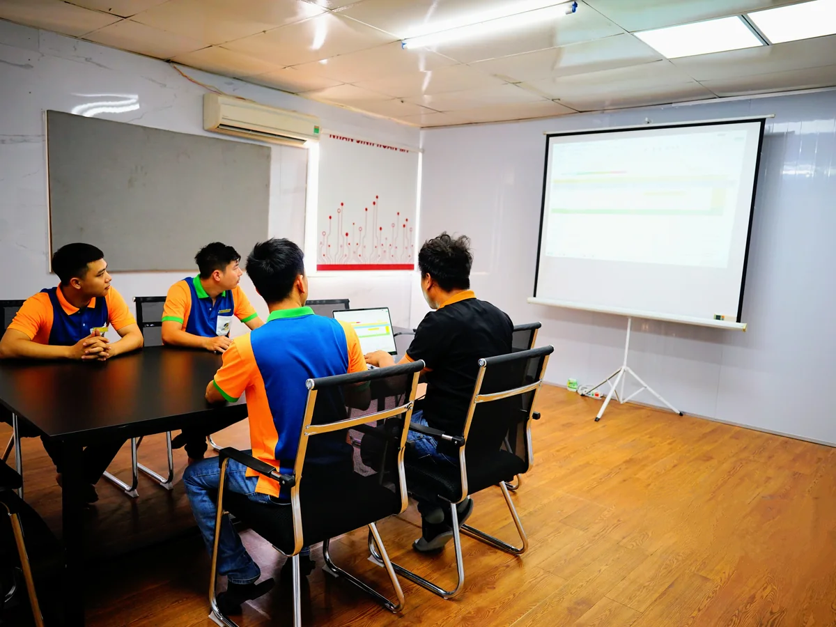Engineers reviewing a customer drawing in the meeting room at Far East High Tech
