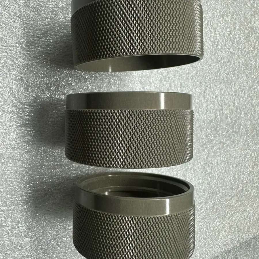 Three CNC turned rings with diamond knurling on the outside diameter